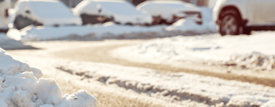 parking lot with cars and snow