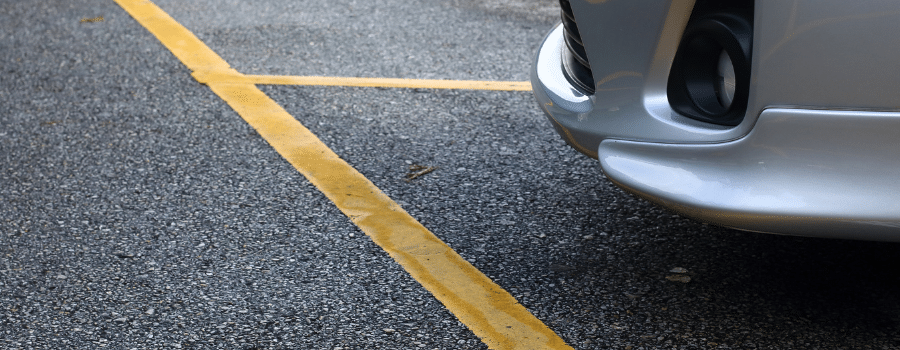 up close parking lot with parked car