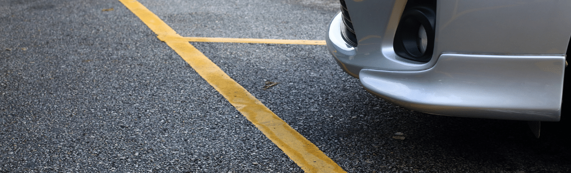 up close parking lot with parked car