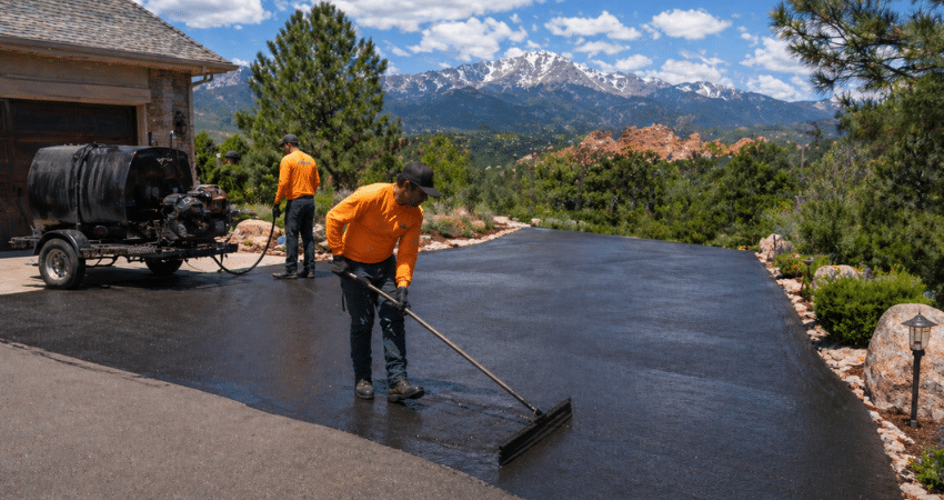 crew sealcoating driveway in Colorado Springs